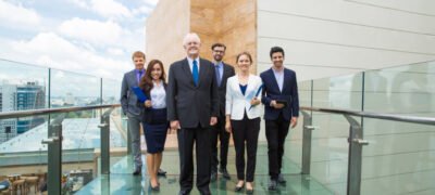 Group business people walking glass walkway
